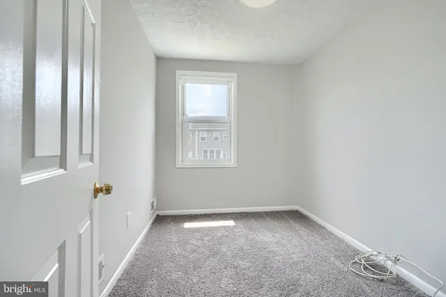 a view of a room with a hallway