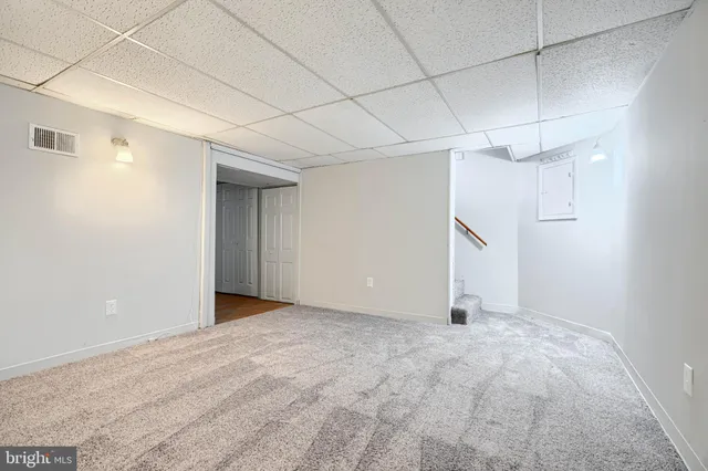 a bathroom with a sink a shower and a mirror