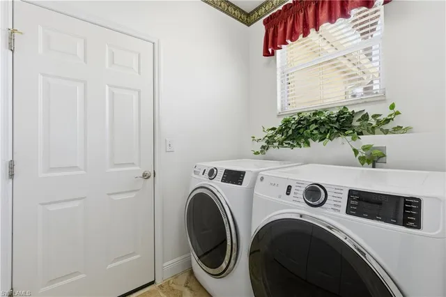 a view of a porch with dining table and chairs