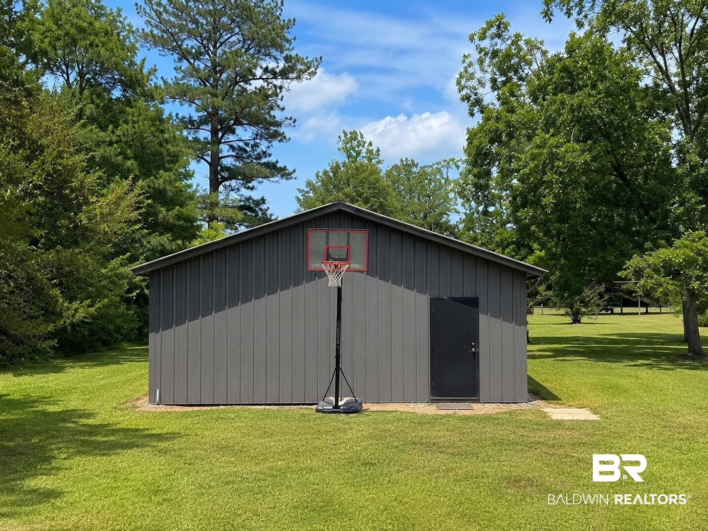 11115 Appleton Road Castleberry, AL 36432 - Photo 12 of 18 Gray metal outbuilding with a sloped roof