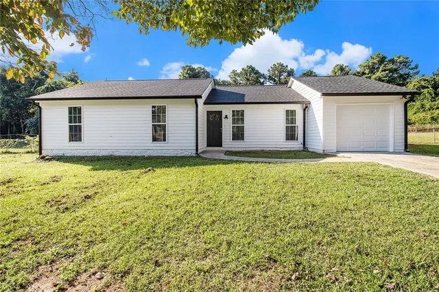 a house view with a garden space