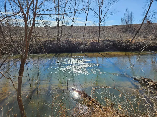 a view of water pond with mountain view