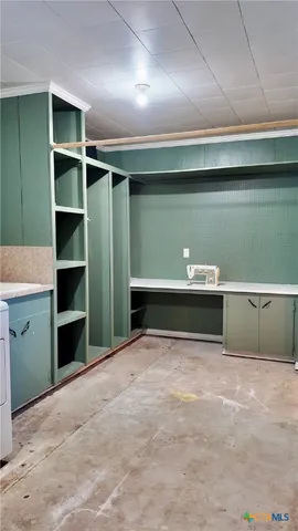 a kitchen with stainless steel appliances granite countertop a stove and a wooden floors