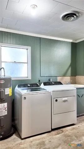 a kitchen with stainless steel appliances granite countertop a lot of counter space and wooden floors