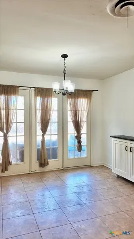 a tree is standing in between the trees