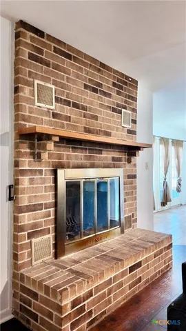 a bedroom with a bed and a fireplace