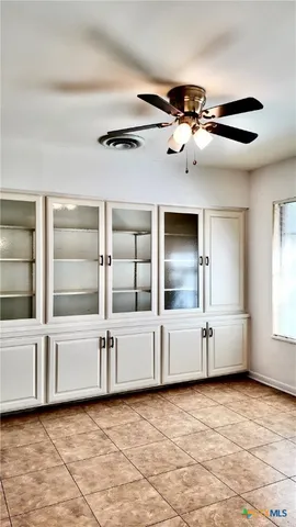 a room with pool table and a chandelier