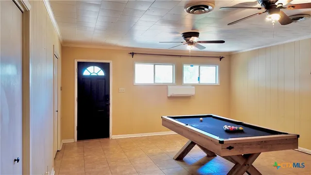 a view of a room with air conditioner and window
