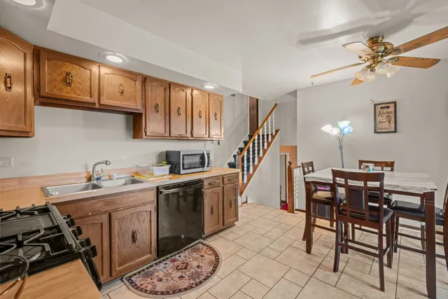 a kitchen with a table chairs and a stove