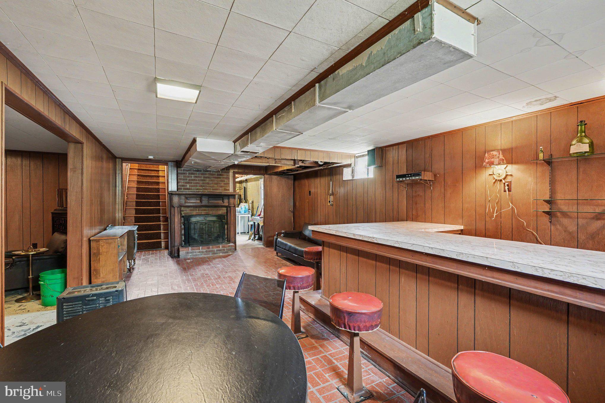 10218 Indiantown Road King George, VA 22485 - Photo 22 of 28 Retro basement bar with cozy charm.