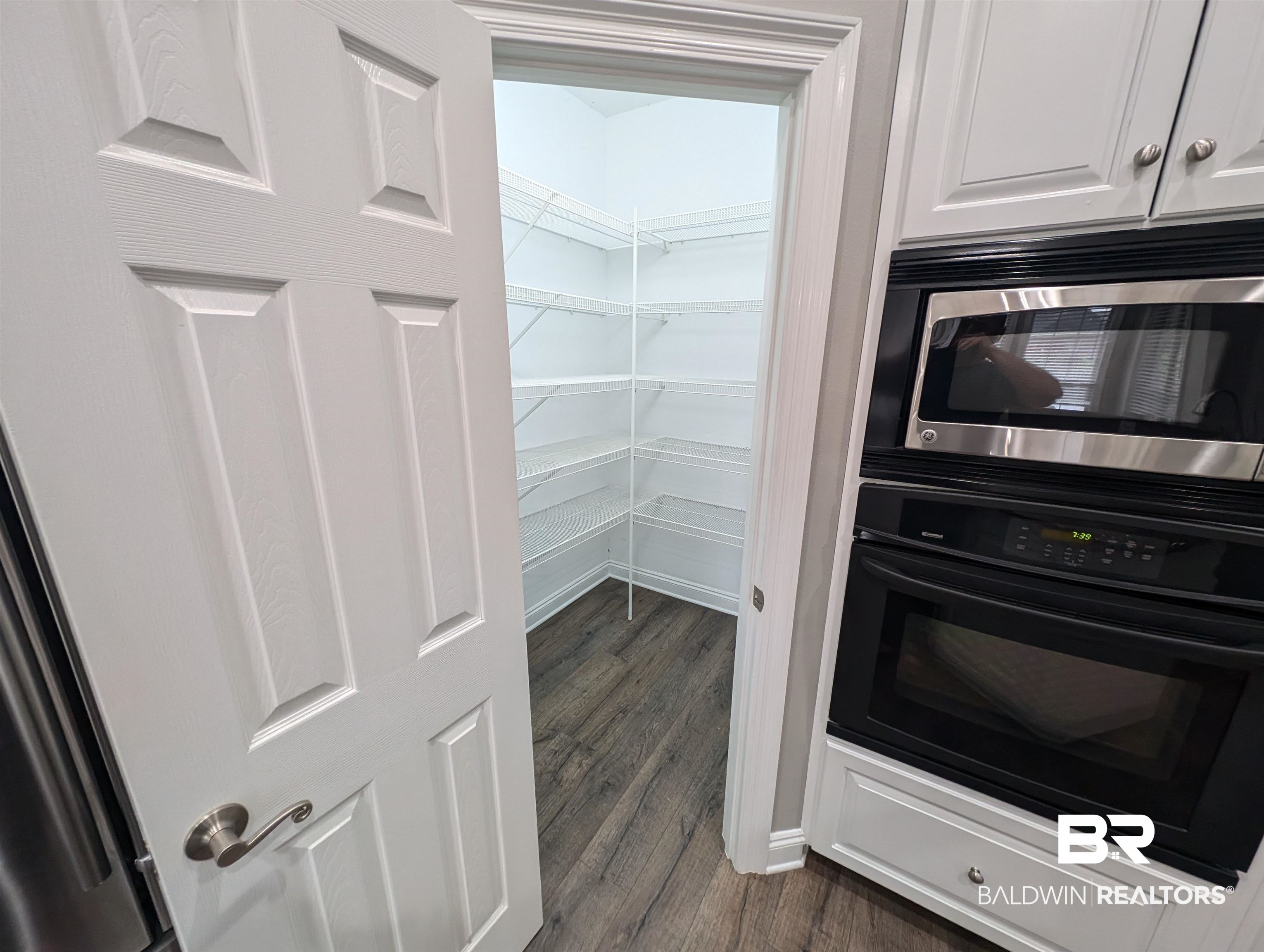11623 Halcyon Loop Daphne, AL 36526 - Photo 28 of 90 Large walk-in pantry for easy access to the ingredients for cooking family meals and the space to keep it organized.