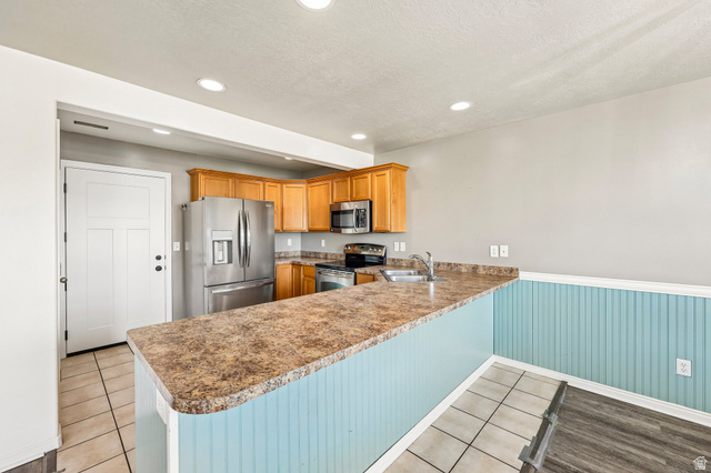 3215 West 450 North West Point, UT 84015 - Photo 8 of 40 Kitchen featuring wood cabinetry, stainless steel appliances, and recessed lighting