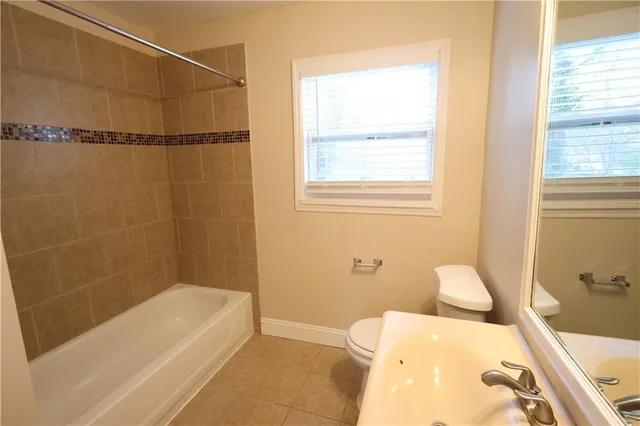 a bathroom with a bathtub and shower
