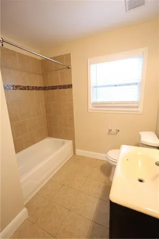 a bathroom with a bathtub and a sink
