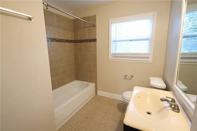 a bathroom with a bathtub and a sink