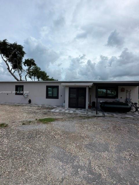 20465 Southwest 200th Street Miami, FL 33187 - Photo 31 of 36 a view of a house with a yard and garage