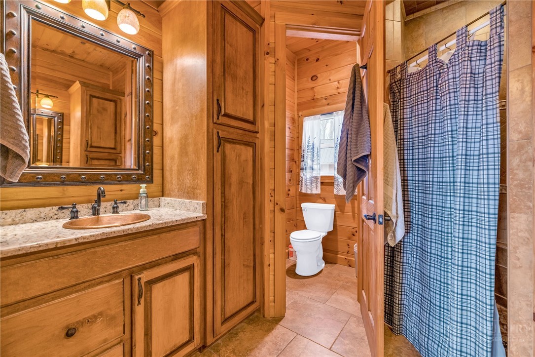 7994 3 Top Road Todd, NC 28684 - Photo 18 of 50 a bathroom with a sink and a mirror