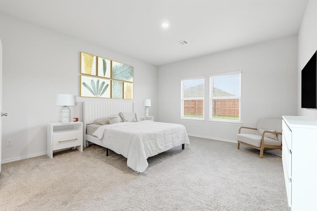 1354 Turkey Run Drive Denton, TX 76207 - Photo 11 of 29 a spacious bedroom with a bed and a window