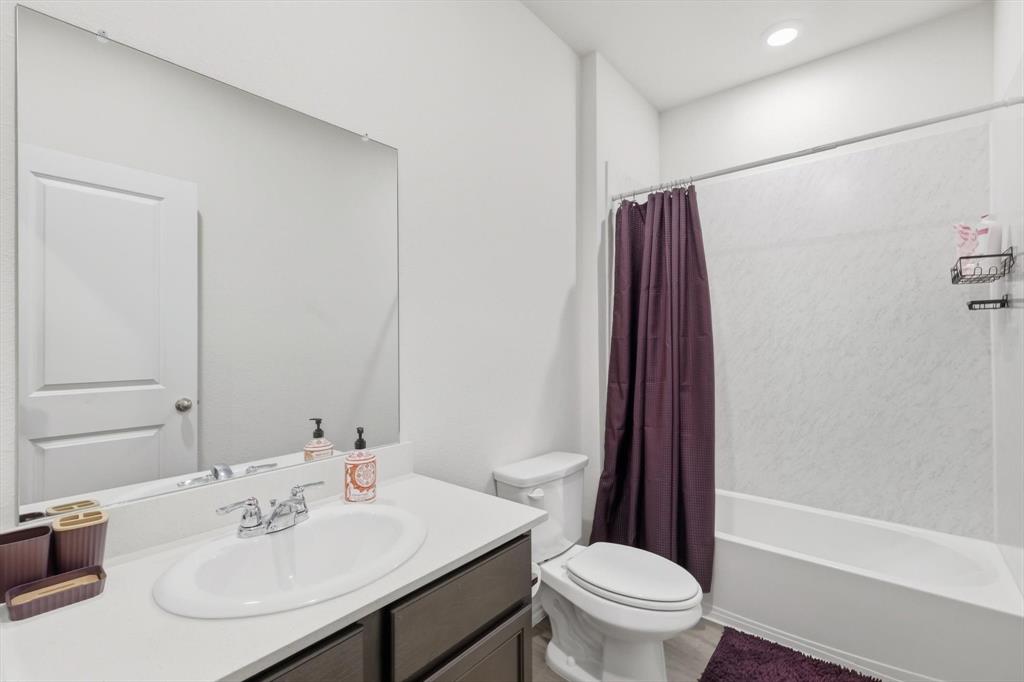 1354 Turkey Run Drive Denton, TX 76207 - Photo 13 of 29 a bathroom with a sink toilet and shower