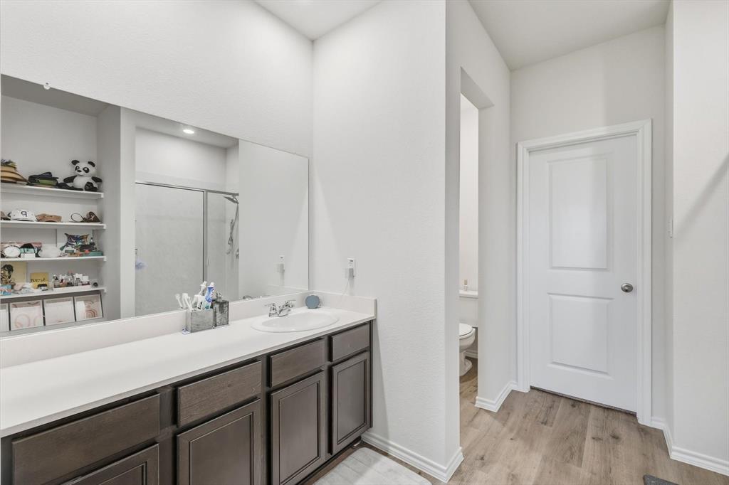 1354 Turkey Run Drive Denton, TX 76207 - Photo 14 of 29 a bathroom with a double vanity sink and mirror