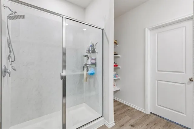 a bathroom with a double vanity sink and mirror