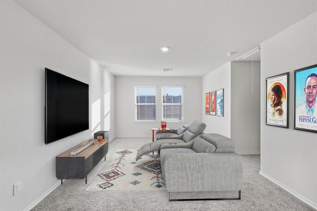 1354 Turkey Run Drive Denton, TX 76207 - Photo 16 of 29 a living room with furniture and a flat screen tv