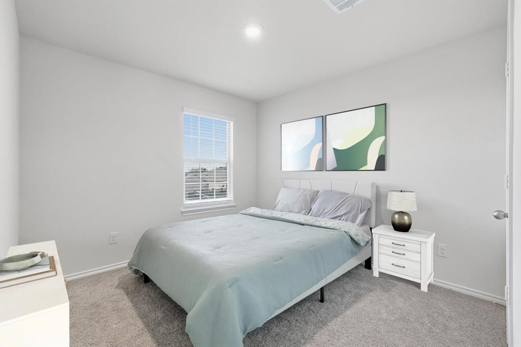1354 Turkey Run Drive Denton, TX 76207 - Photo 18 of 29 a bedroom with a bed and a window