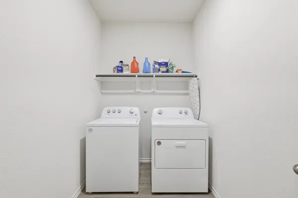 a bedroom with a bed and a table