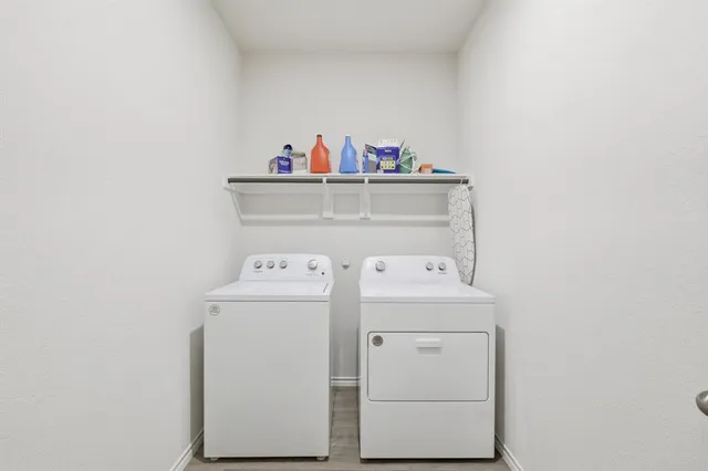 a bedroom with a bed and a table