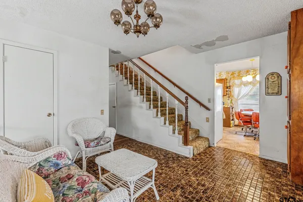 a bedroom with a bed and a table