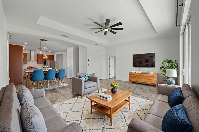 a view of empty room with wooden floor and window