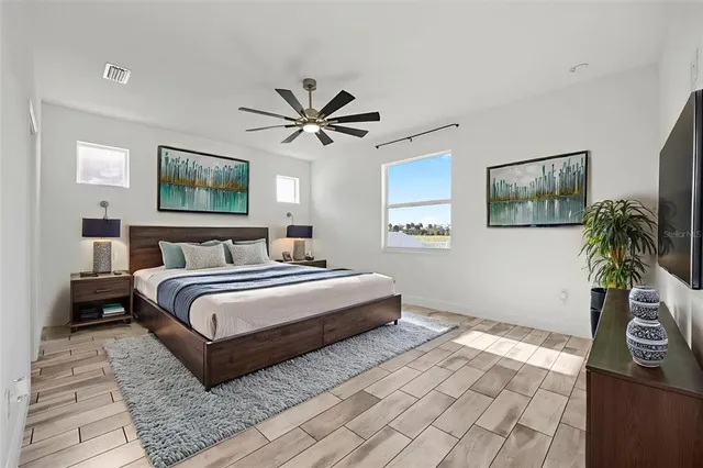 a view of empty room with wooden floor