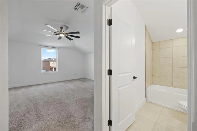 a view of a glass door with a yard from a window