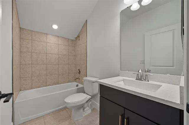 a view of a house with a garden and yard