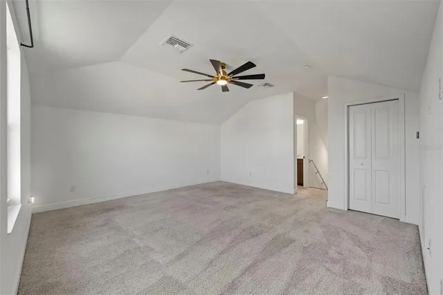 an aerial view of house with ocean view