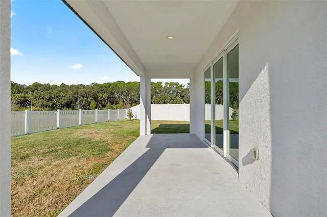 an aerial view of a house with a swimming pool