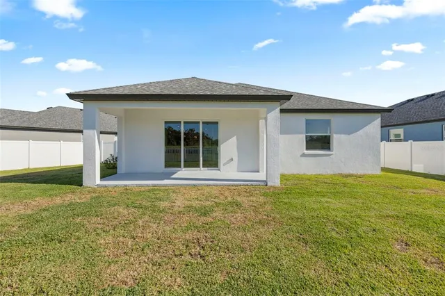 a view of a lake with a house in the background