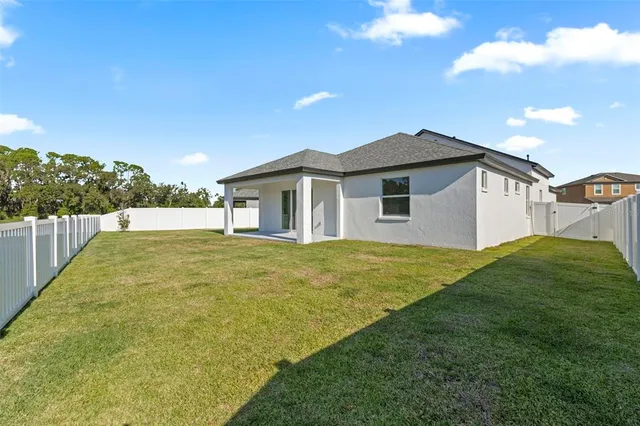 an aerial view of a house with swimming pool