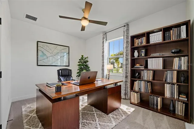 a view of a workspace with furniture