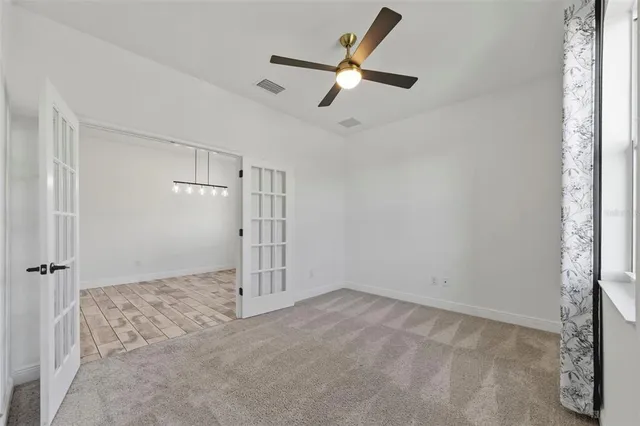 a kitchen with kitchen island a counter top space a sink and cabinets