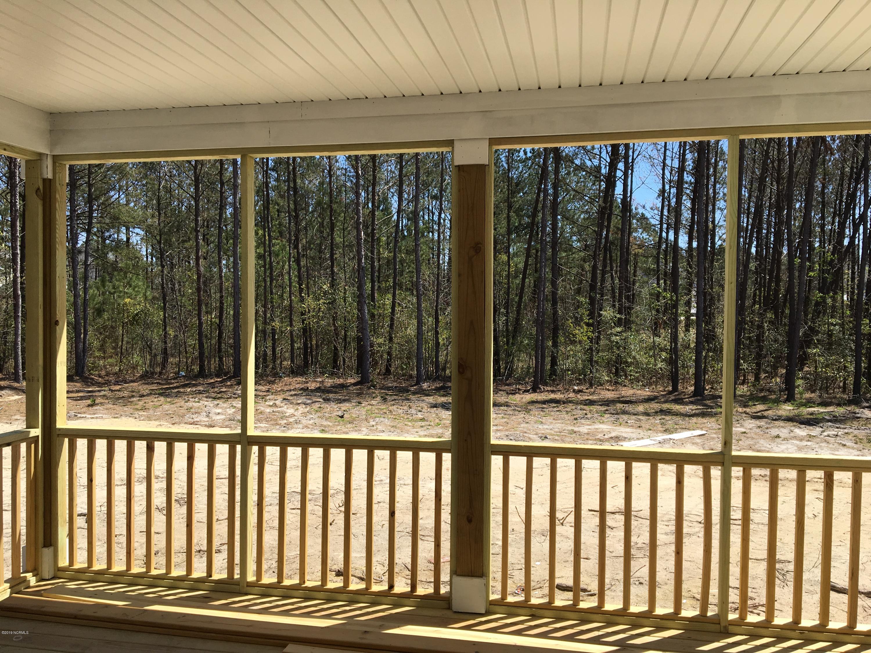 404 Compass Point Hampstead, NC 28443 - Photo 13 of 22 screened porch