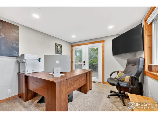 a workspace with furniture and a window