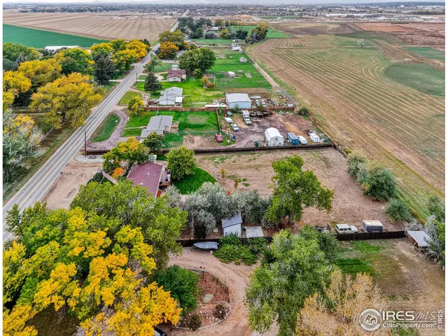 an aerial view of a residential houses with outdoor space