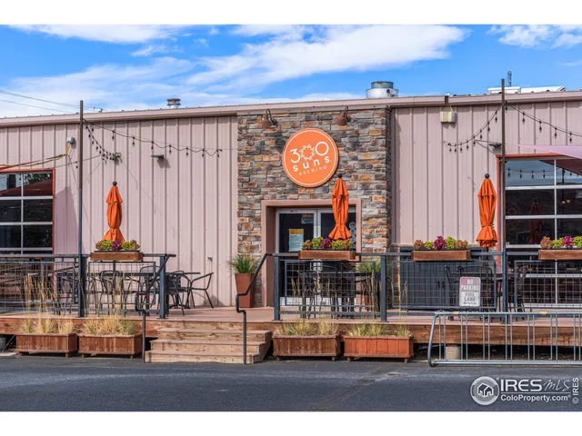 a view of a living room with wooden floor