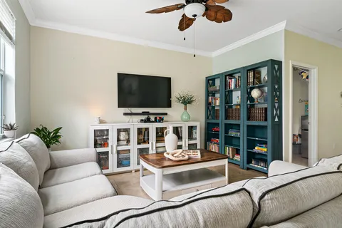 a bathroom with a granite countertop toilet sink and mirror