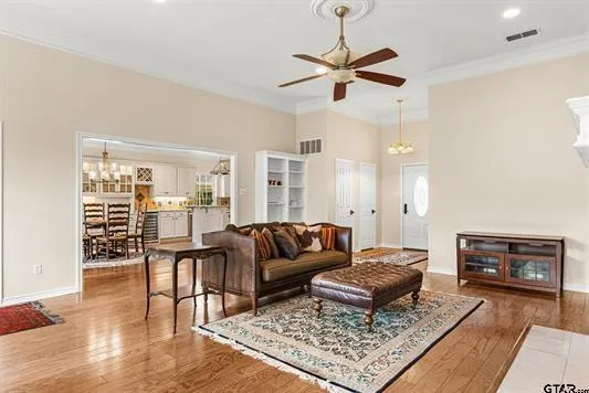 a living room with furniture and a rug