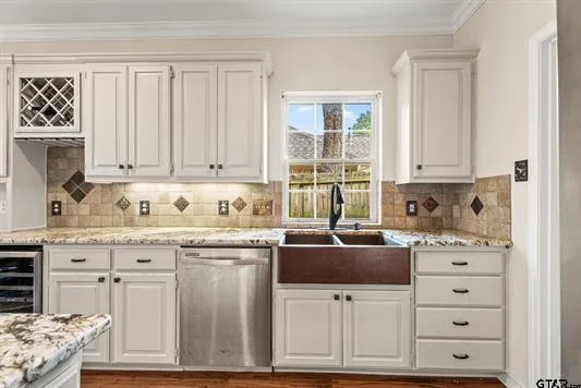 a kitchen with granite countertop a sink and cabinets