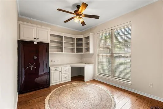 a view of a livingroom with a fireplace and a window