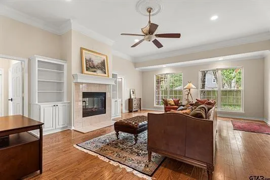 a living room with furniture windows and a fireplace