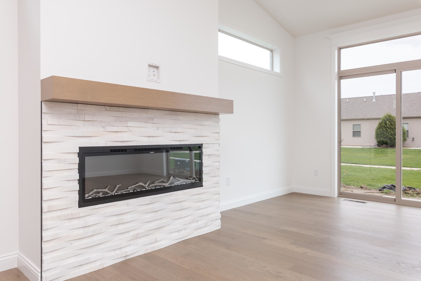 1922 Dunraven Road Bloomington, IL 61704 - Photo 32 of 55 an empty room with wooden floor fireplace and windows